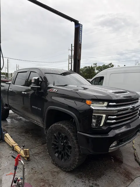 Black Chevy Silverado 2500HD Z71 at the lift